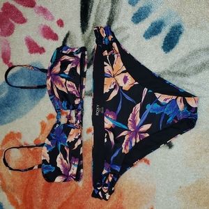 Roxy black floral bikini. Top size medium, bottom size large.